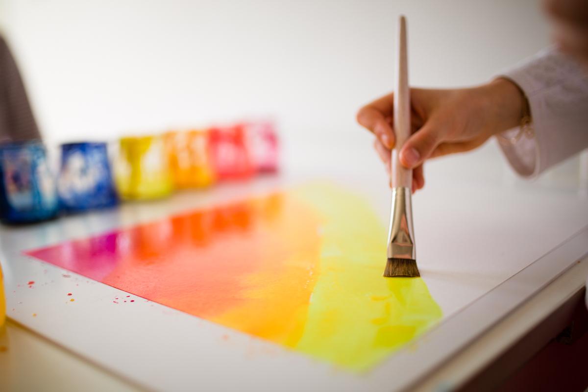 Child painting with watercolours